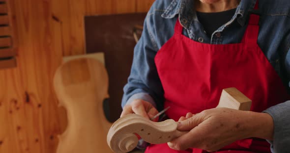 Female luthier at work in her workshop