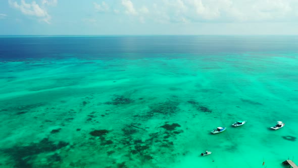 Luxury overhead clean view of a white sand paradise beach and blue ocean background in colourful 4K