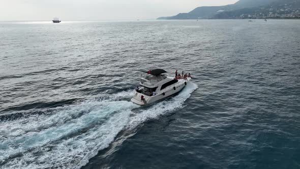 People dancing on a yacht aerial view 4 K Turkey Alanya