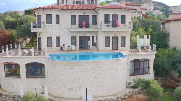 Aerial View of Couple Relaxing at Swimming Pool Villa in Kas Turkey