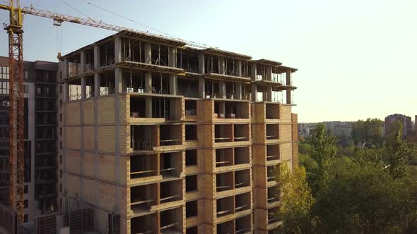 Aerial view of tall residential apartment buildings under construction.