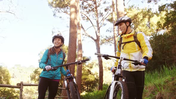 Mountain biking couple interacting with each other