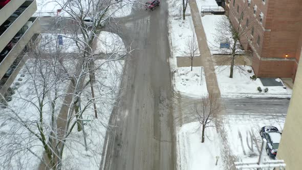 An aerial drone shot moving backwards while slowly panning up to reveal the scenery of a city during