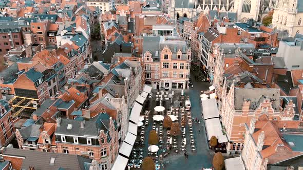 Fly-over Oude Markt Square reveal Saint Peter's Church, Belgium Leuven