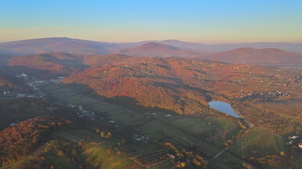 Beautiful sunset in below panorama valley lake with mountains