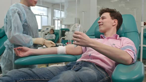 Young Man Getting Blood Donor Agreement