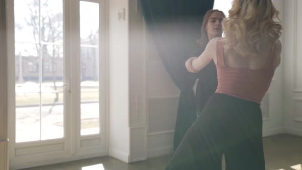 a Young Couple is Dancing in a Spacious Bright Room