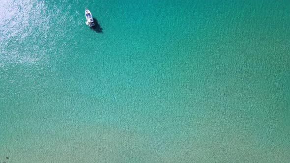 Calm and peaceful macro shot of the turquoise sea shore during daytime