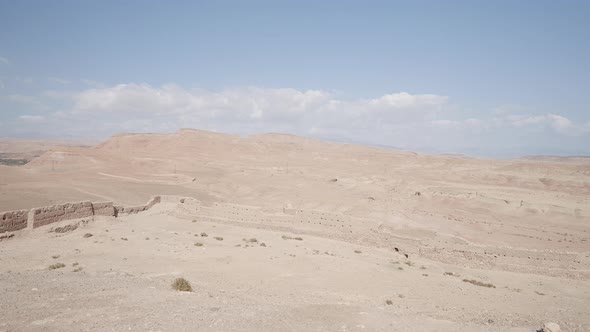 Sandy Desert on Blue Cloudy Background