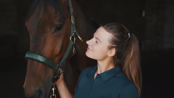 Horsewoman Smiling And Posing With Her Dark Bay Horse In The Stable  Horse Love