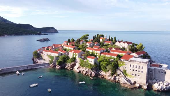 Flying Over Scenic Island on the Rock in the Sea