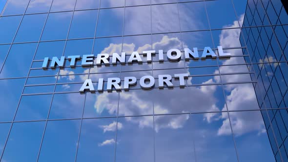 Airplane take off in reflection of the glass windows of the airport building