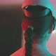 Close up of young woman in vr goggles looking around in blue neon lights - VideoHive Item for Sale