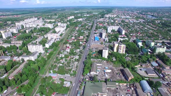 Cityscape View From Above. Aerial shot of the houses and streets of small city at day