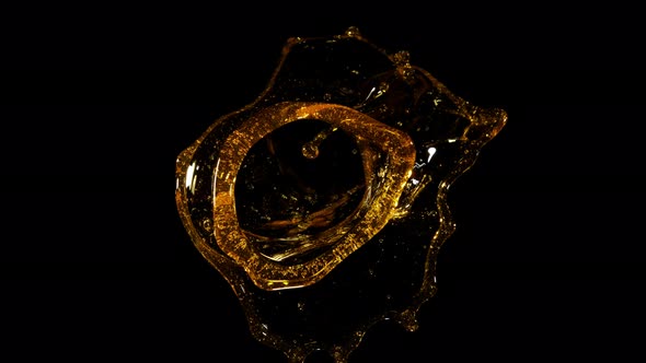 Super Slow Motion Shot of Rotating Oil Whirl Isolated on Black Background at 1000Fps