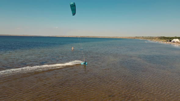 Aerial View Slow Motion Active Man Kiteboarding and Windsurfing Active Lifestyle Extreme Sport