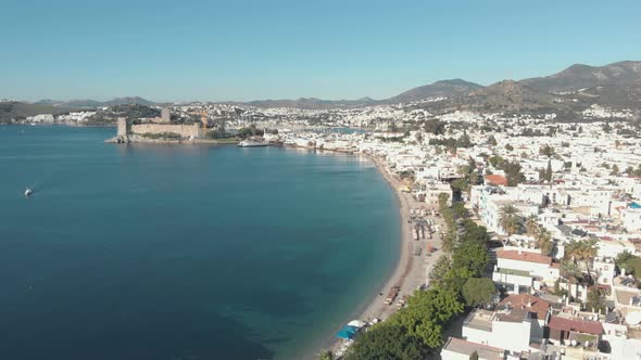 Aerial 4k drone footage flying over the coastline of the city of Bodrum, Turkey. 