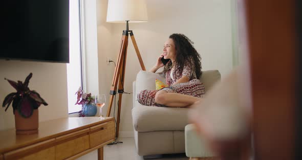 A mixed race woman with curly hair