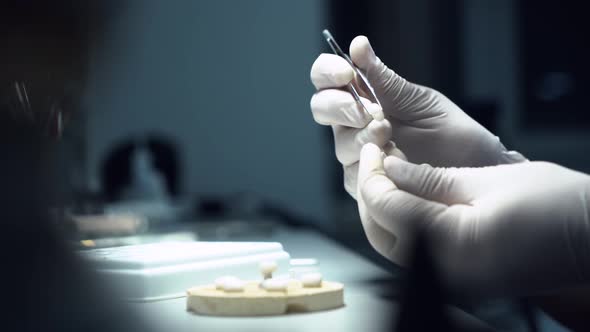 dental technician creates dental prostheses. laboratory. close-up.