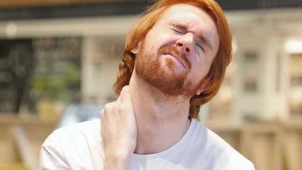 Redhead Beard Man with Serious Neck Pain Indoor