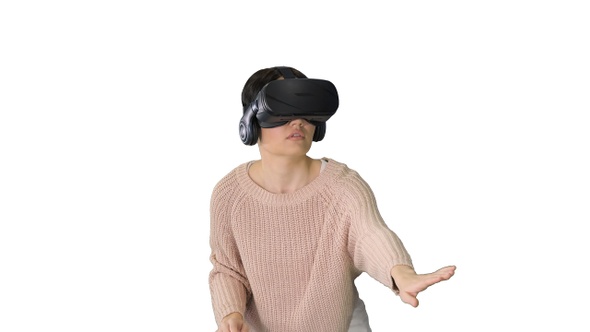 Cute Young Woman Walking and Using Interactive Vr Headset