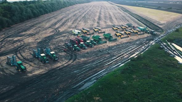 Top Down View of Harvesting Machines in Field alt