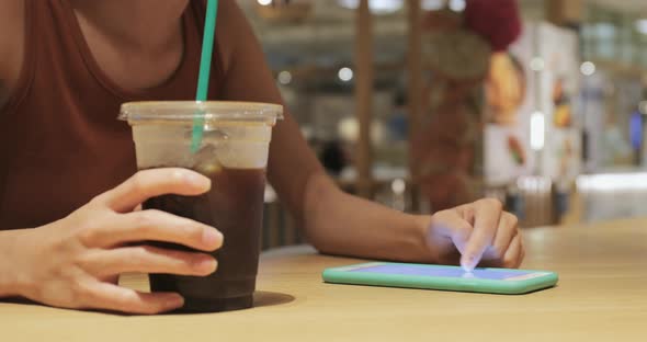 Using mobile phone in coffee shop