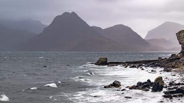 Elgol Beach at Port Na Cullaidh with Red Cuillin Mountains Under Clouds on Loch Scavaig Scottish