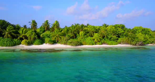 Tropical birds eye clean view of a white sandy paradise beach and aqua turquoise water background 