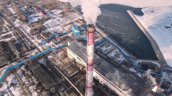 Emission carbon gas from factory pipes with smoke in atmosphere
