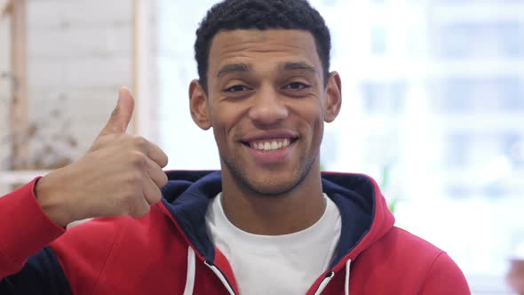 Portrait of AfroAmerican Man Gesturing Thumbs Up