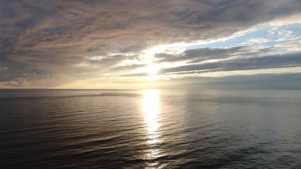 Sunset with Clouds Over the Beach