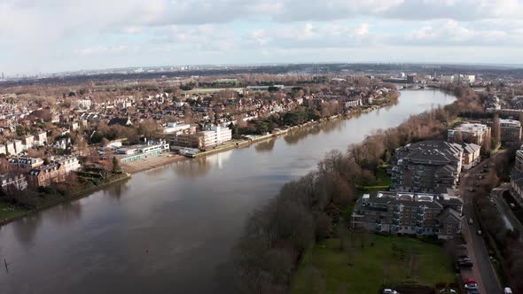 Cinematic rotating drone shot of Thames river from west London chiswick mortlake