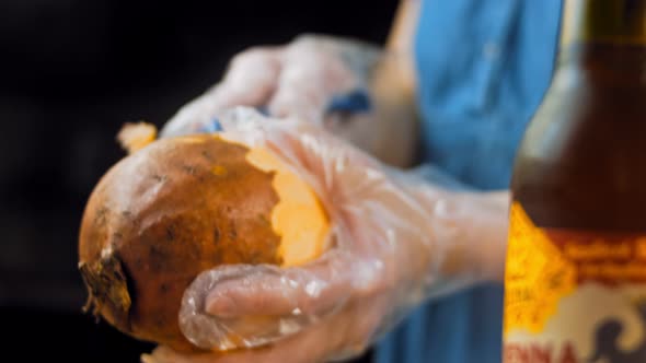 The Chef Peels the Sweet Potatoes with a Special Knife