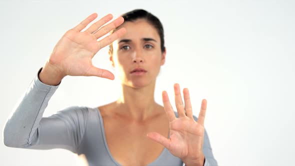 Woman gesturing on white background