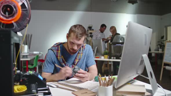 Bearded Engineer Working on 3d Printed Puzzle