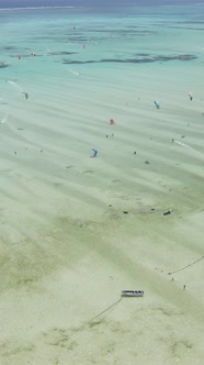 Vertical Video Kitesurfing Near the Shore of Zanzibar Tanzania