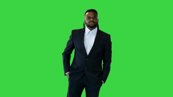 Black Man in Office Suit Having a Conversation on a Green Screen Chroma Key