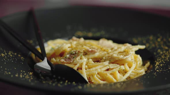 Close Up Shoot of Classic Carbonara Spaghetti Pasta with Egg and Parmesan Cheese and Herbs