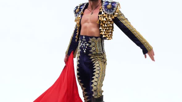 Torero in Blue and Gold Suit or Typical Spanish Bullfighter Isolated Over White Studio Background