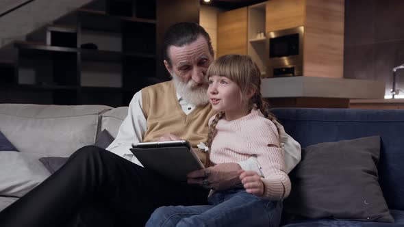 Granddaughter with Amusing Pigtails Spending Her Leisure with Good-Looking Mature Bearded Granddad