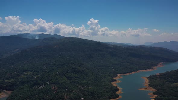 Aerial view of a river crossing the forest in Nuwara Eliya, Sri Lanka.