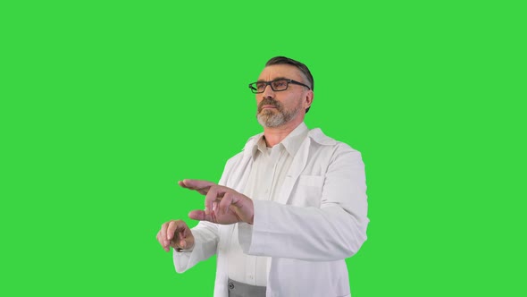 Doctor Scientist Looking and Using Virtual Touch Screen on a Green Screen Chroma Key