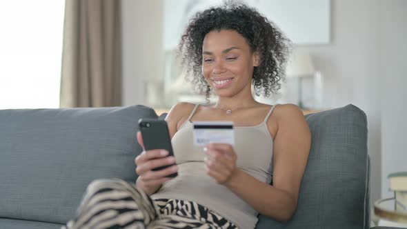 Successful Online Payment on Smartphone By African Woman at Home