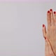 Beautiful woman's hands with bright red manicure, one hand gently massaging the other - VideoHive Item for Sale