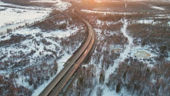 Unusual Winter Landscape with a Motor Road at Sunset Aerial View