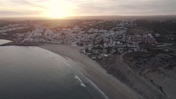 Sunset wide aerial view of Praia da Luz beach, Algarve, Portugal. Holidays destination