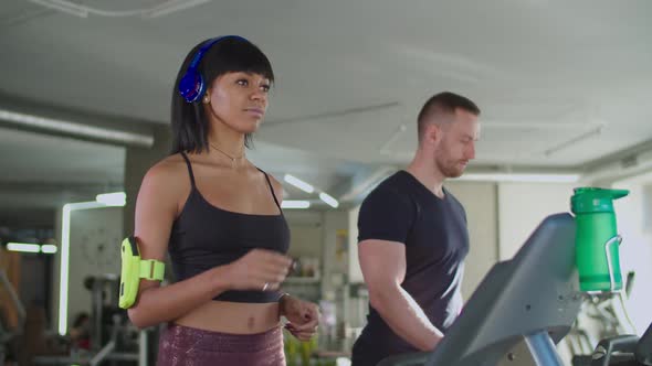 Diverse Fitness People Working Out on Treadmill