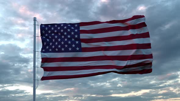 Realistic Flag of United States Waving in the Wind Against Deep Dramatic Sky. UHD 60 FPS Slow-Motion