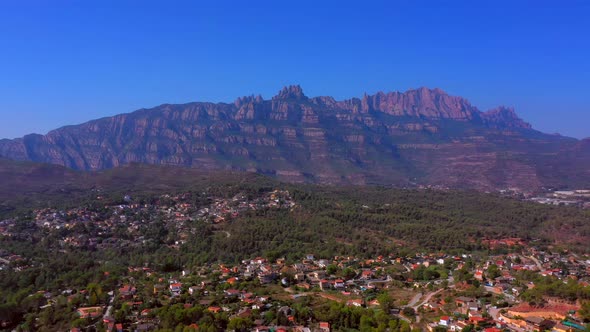 Lateral traveling from left to right of the mountains of Montserrat in Catalonia from Spain. Drone v